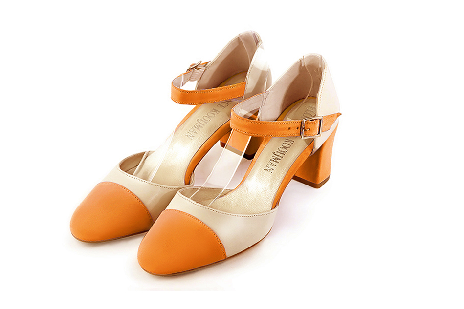 Apricot orange and champagne white open side elegant shoes, with an instep strap. Round toe. Medium block heels.